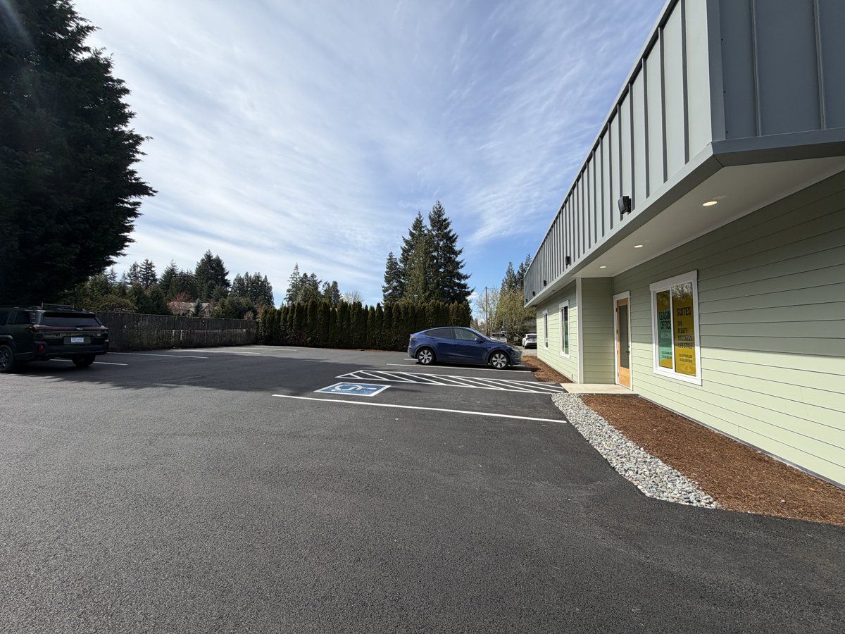 Rear parking area with ample space for tenants and clients